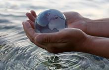 hand holding small globe
