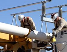 Utility workers fixing power lines